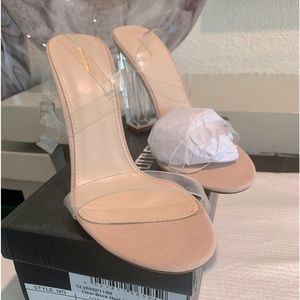 Brand New Clear Strappy high heel shoes with box.  Never worn.